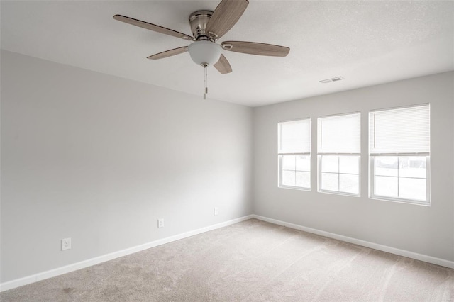 carpeted empty room with ceiling fan