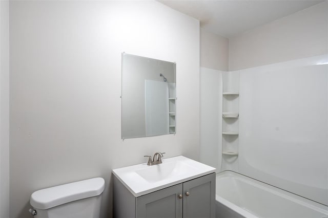 full bathroom with shower / washtub combination, vanity, and toilet