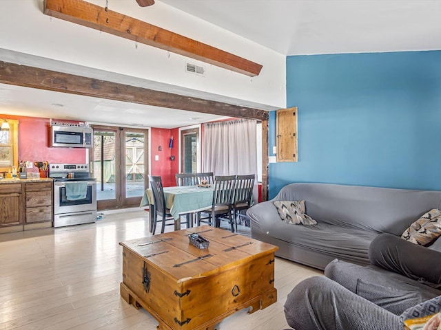 living room with light hardwood / wood-style flooring