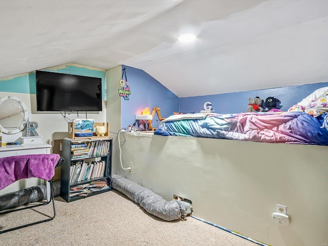 carpeted bedroom featuring lofted ceiling