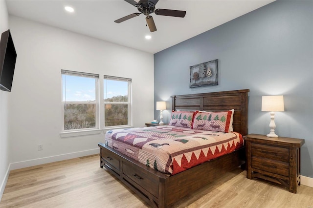 bedroom with ceiling fan and light wood-type flooring