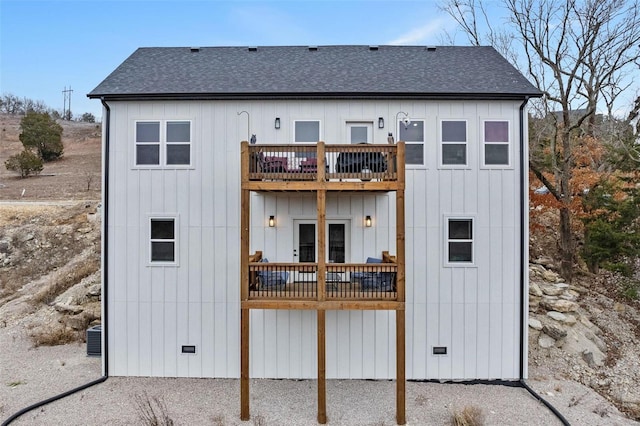 rear view of house with a balcony and central AC