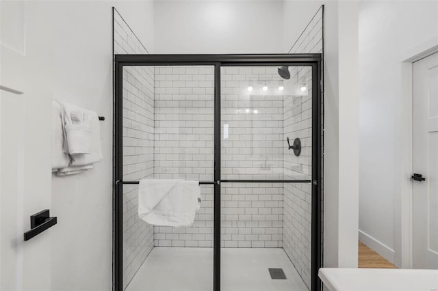 bathroom featuring an enclosed shower