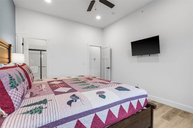 bedroom with ceiling fan and light hardwood / wood-style floors