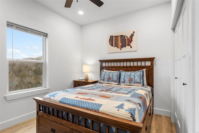 bedroom featuring ceiling fan and light wood-type flooring