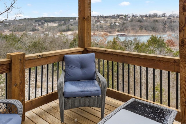 wooden deck with a water view