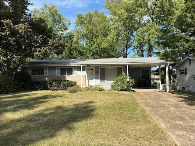 ranch-style home with a carport and a front yard