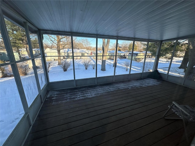 unfurnished sunroom featuring a wealth of natural light