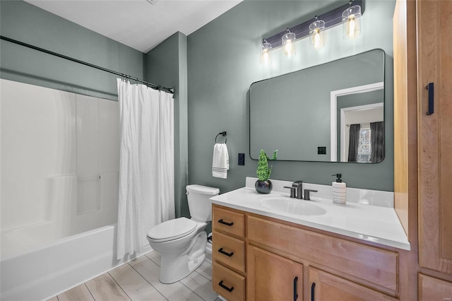 full bathroom featuring shower / bath combination with curtain, toilet, and vanity