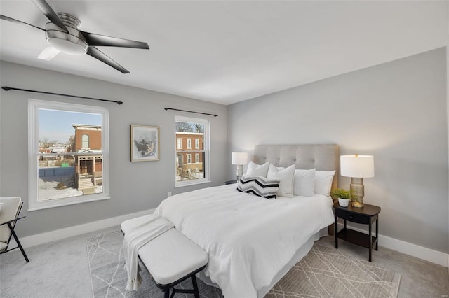 bedroom featuring light carpet and ceiling fan