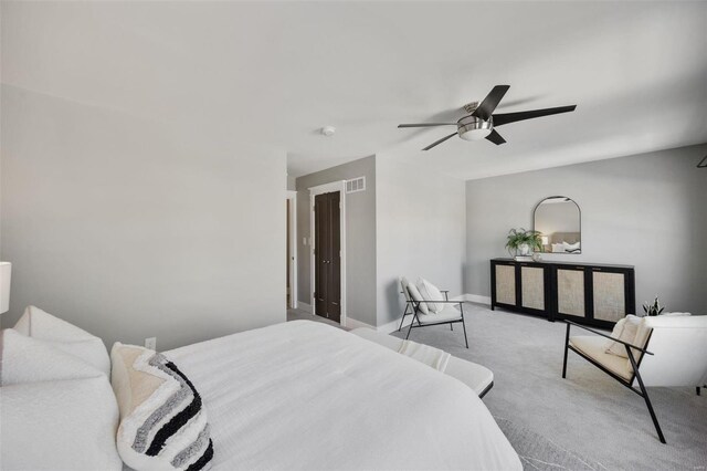 bedroom with light carpet and ceiling fan