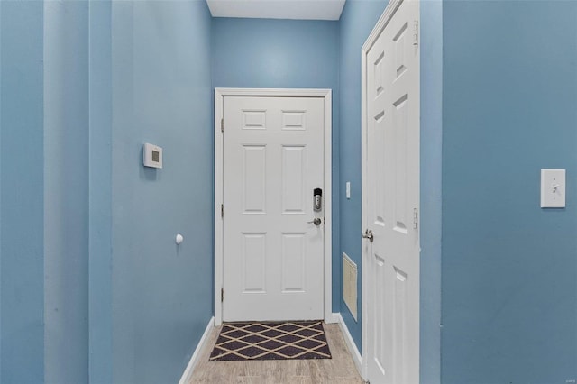 doorway featuring light hardwood / wood-style floors