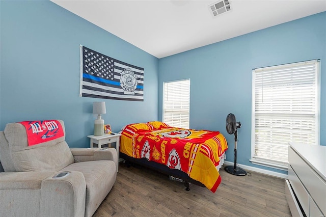 bedroom featuring dark hardwood / wood-style floors