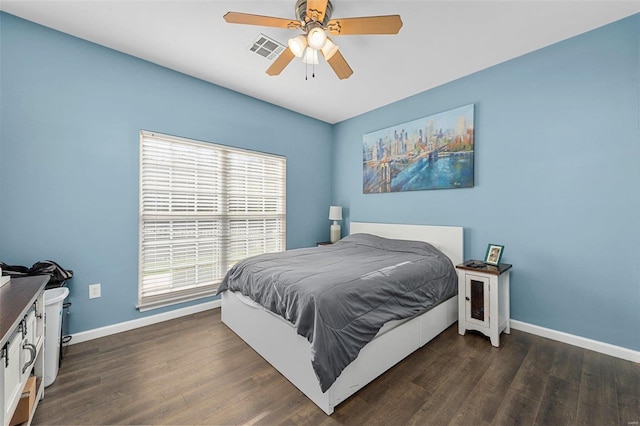 bedroom featuring ceiling fan and dark hardwood / wood-style floors