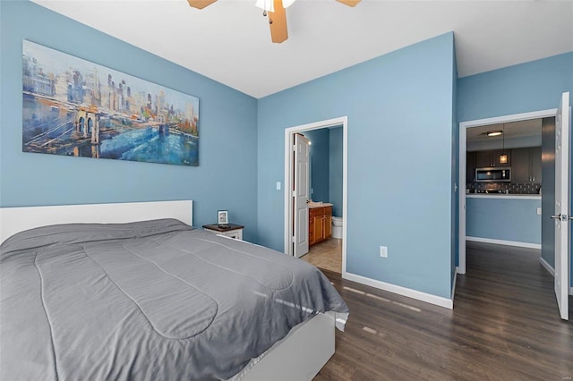 bedroom with ceiling fan, dark hardwood / wood-style floors, and ensuite bath