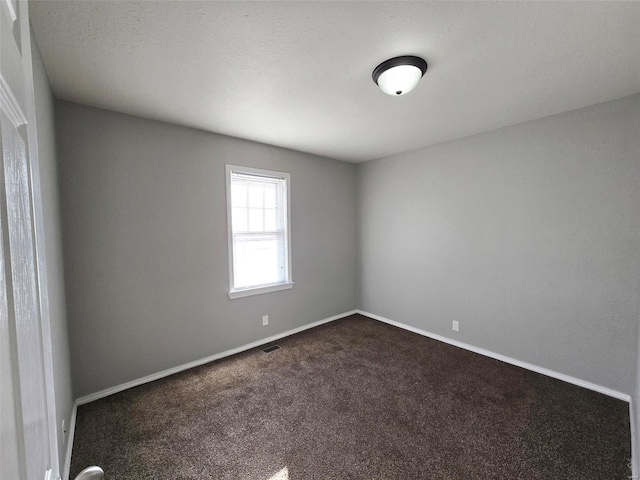 empty room featuring carpet