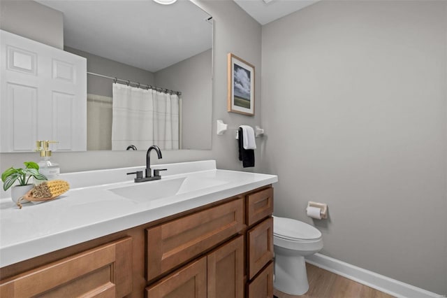 bathroom with a shower with shower curtain, vanity, toilet, and wood-type flooring