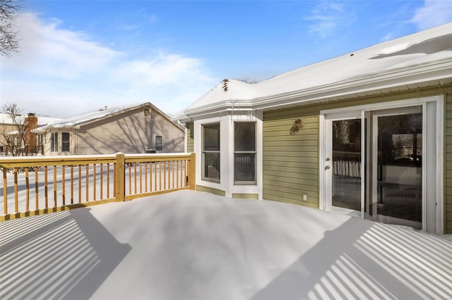 view of snow covered deck