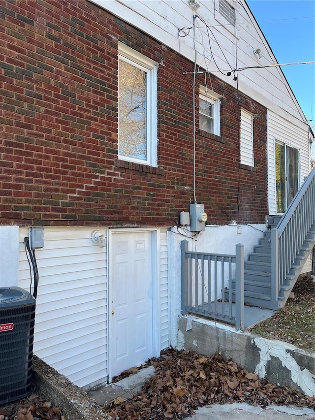 view of property exterior with central AC