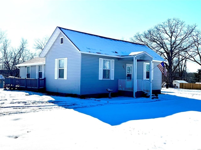 view of front of house with a storage shed