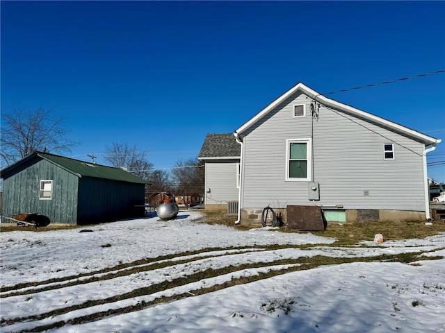 view of snow covered house