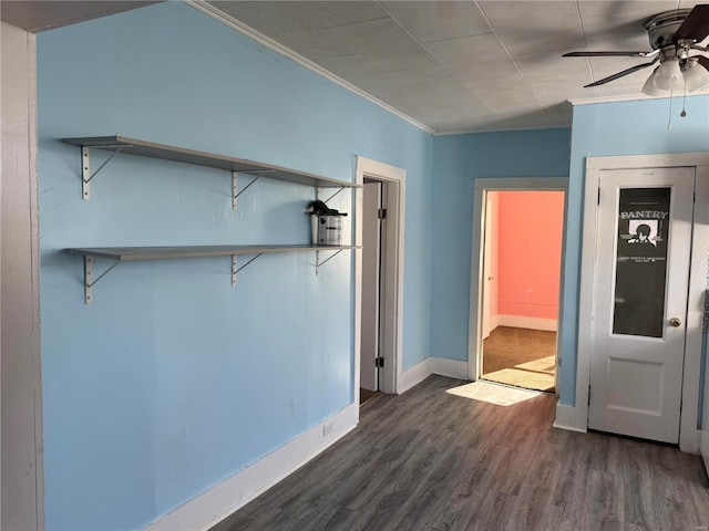 interior space with ceiling fan, crown molding, and dark hardwood / wood-style floors