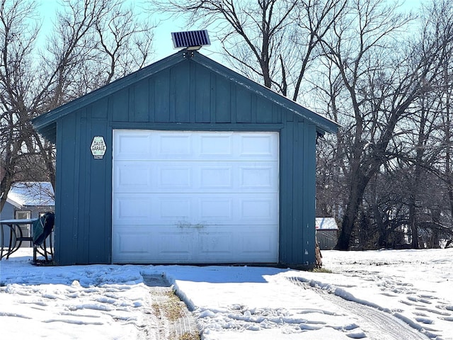 view of snow covered garage