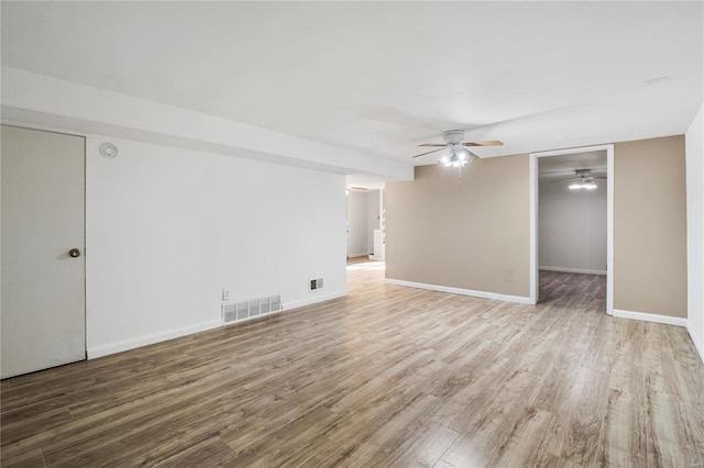 unfurnished room with ceiling fan and light hardwood / wood-style floors