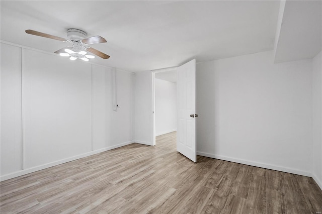 unfurnished room featuring ceiling fan and light wood-type flooring