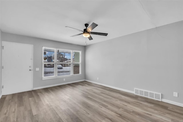 spare room with ceiling fan and light hardwood / wood-style floors