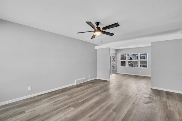 unfurnished living room featuring ceiling fan and light hardwood / wood-style floors