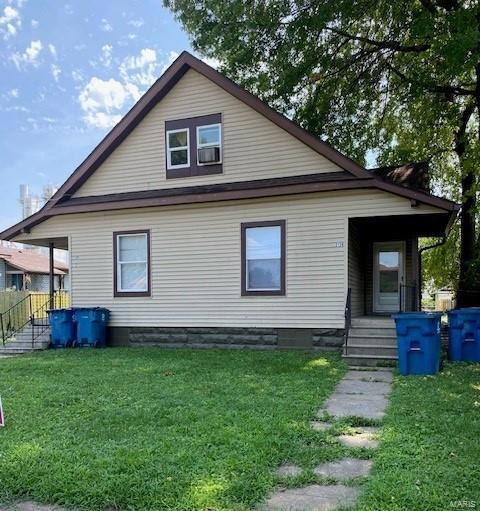 view of side of home featuring a lawn