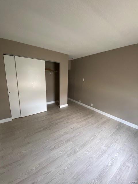 unfurnished bedroom featuring wood-type flooring