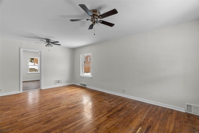 spare room with ceiling fan and hardwood / wood-style flooring