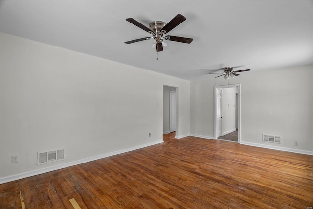 empty room featuring hardwood / wood-style flooring and ceiling fan