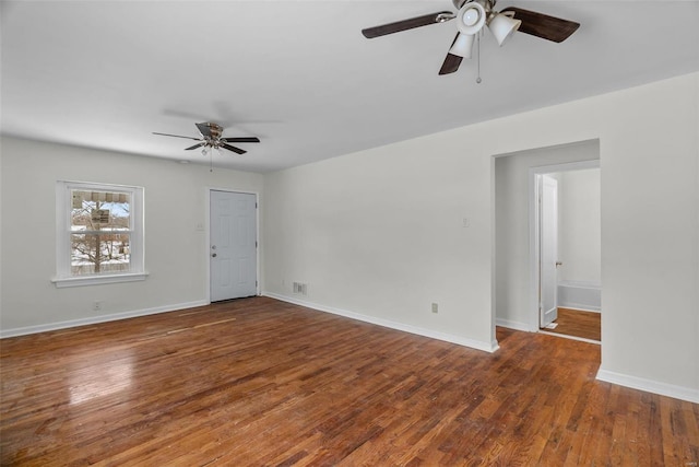 unfurnished room with dark hardwood / wood-style flooring and ceiling fan