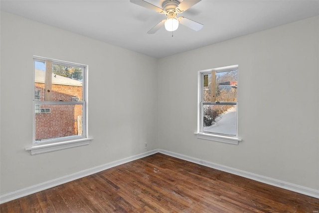 spare room with ceiling fan and hardwood / wood-style flooring