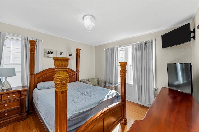 bedroom with light hardwood / wood-style floors