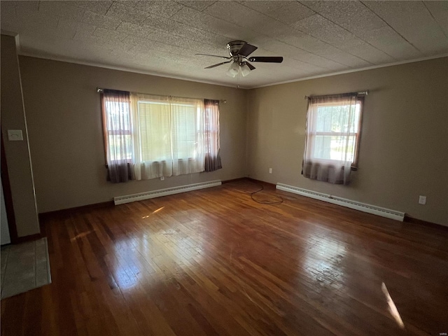 unfurnished room featuring ceiling fan, a wealth of natural light, and a baseboard radiator