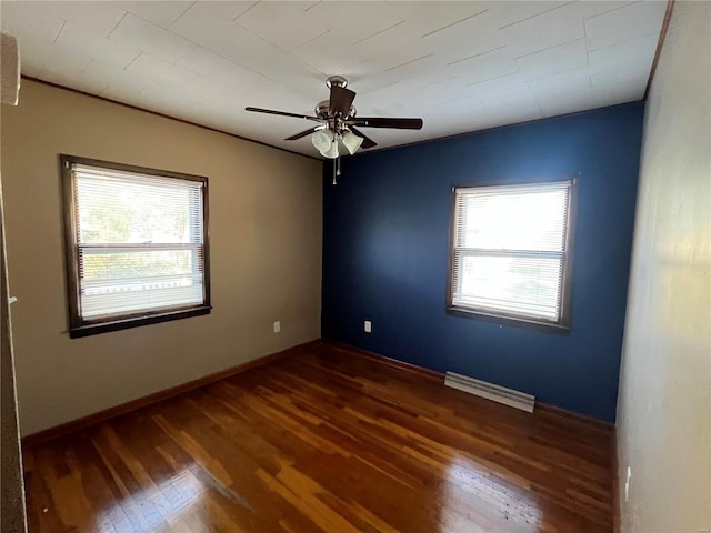 spare room with dark wood-type flooring