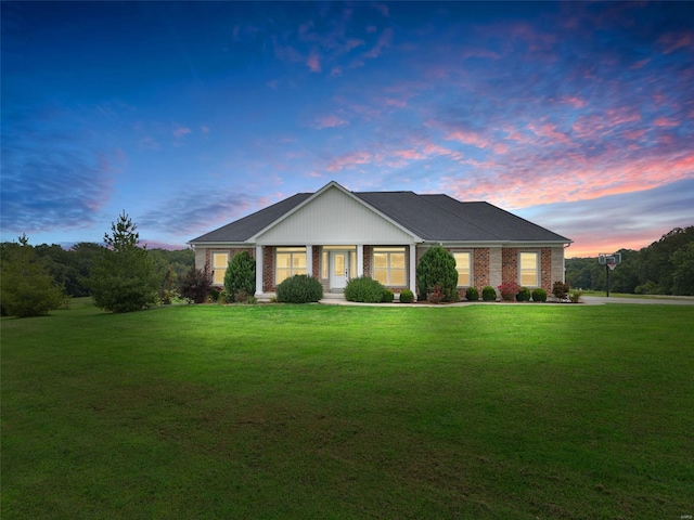 view of front of home with a lawn