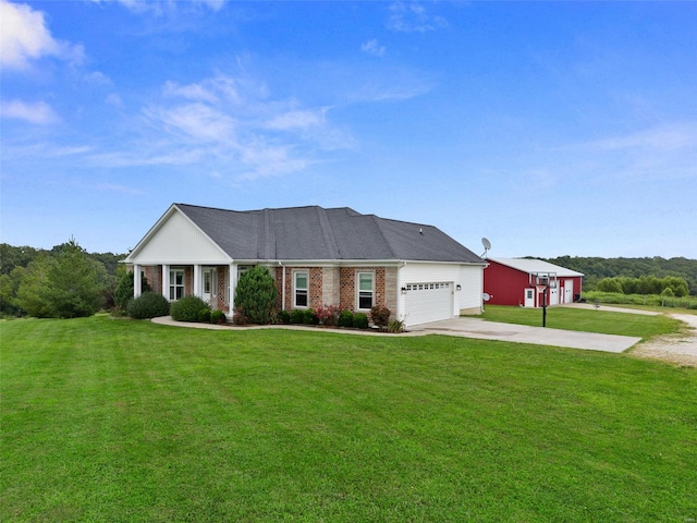 view of front of home featuring a garage and a front lawn