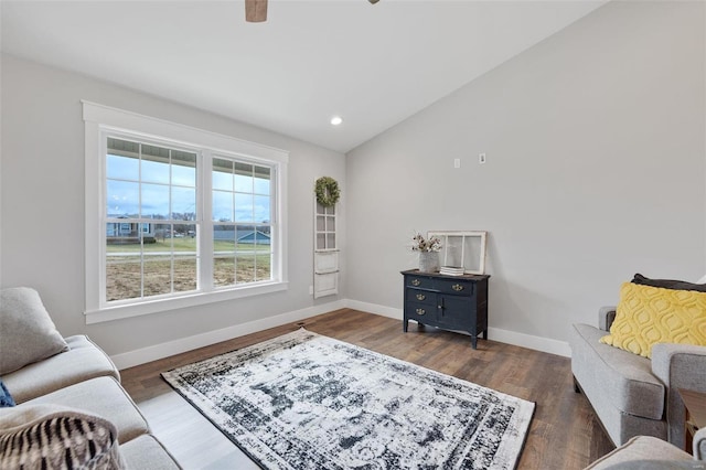 sitting room with vaulted ceiling and dark hardwood / wood-style floors