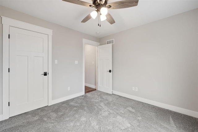 unfurnished bedroom with carpet and ceiling fan