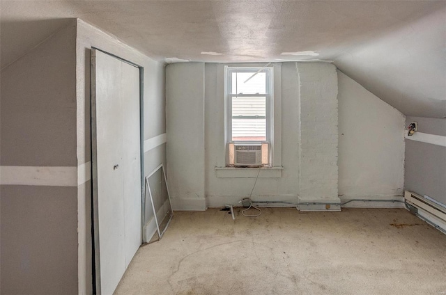 bonus room with a textured ceiling, cooling unit, and vaulted ceiling