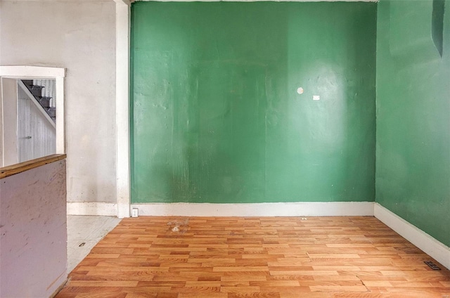 empty room with light hardwood / wood-style floors