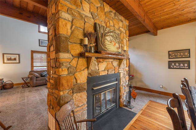 unfurnished living room with a wealth of natural light, carpet floors, and wood ceiling