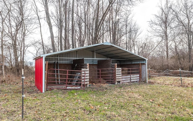 view of outbuilding with a yard