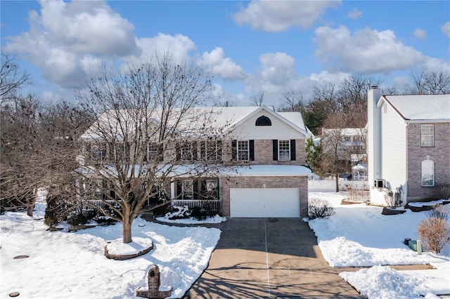 front of property with a garage