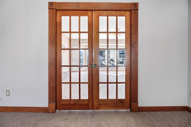 doorway to outside with french doors and carpet